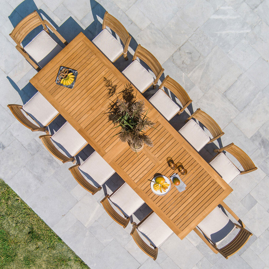 Calypso solid teak outdoor dining table with butterfly extension leaves